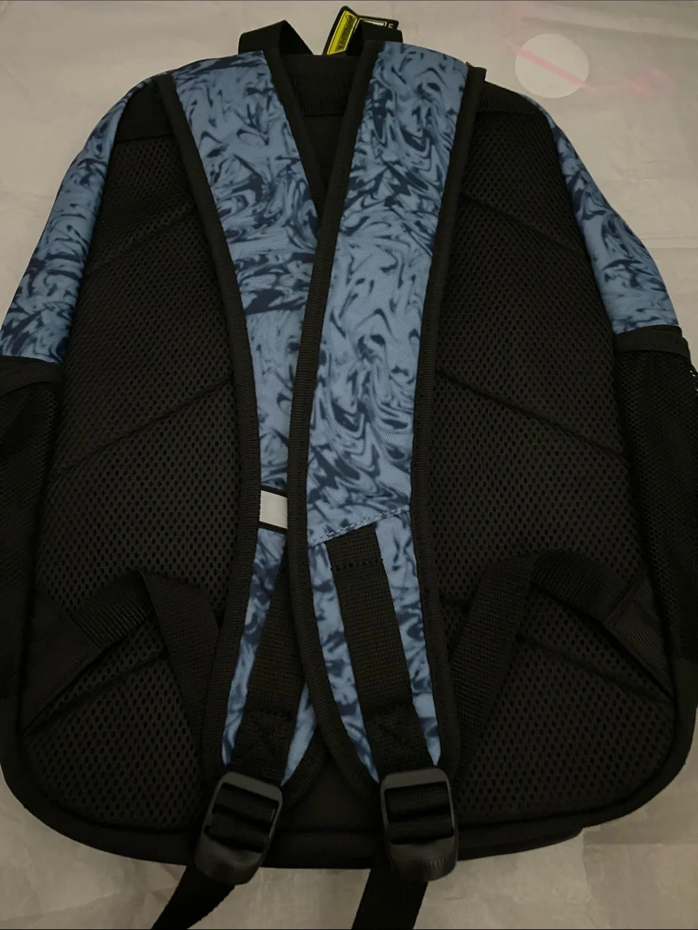 Puma Blue Marble Backpack with Orange Logo and Black Accents